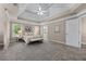 Spacious main bedroom with trey ceilings, carpet and ample natural light at 4648 Glenshire Pl, Atlanta, GA 30338