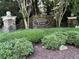Stone sign surrounded by lush greenery marks the entrance to Ashford Chase community at 4648 Glenshire Pl, Atlanta, GA 30338