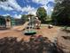 Neighborhood playground showcasing a slide, merry-go-round, and a tunnel for recreation at 4648 Glenshire Pl, Atlanta, GA 30338