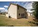 View of the home's backyard showcasing the lawn and the exterior at 856 Donington Cir, Lawrenceville, GA 30045