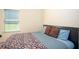 Cozy bedroom with a large window and colorful bedding at 856 Donington Cir, Lawrenceville, GA 30045