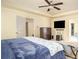 A soothing bedroom with a tray ceiling, carpet, ceiling fan, and two doorways at 856 Donington Cir, Lawrenceville, GA 30045