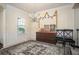 Elegant dining room with wainscoting, a chandelier, and large window offering ample natural light at 856 Donington Cir, Lawrenceville, GA 30045