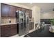 Kitchen with stainless steel refrigerator, tile backsplash, and access to dining area at 856 Donington Cir, Lawrenceville, GA 30045