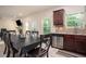 Kitchen dining area featuring stainless steel dishwasher and a view to the backyard at 856 Donington Cir, Lawrenceville, GA 30045