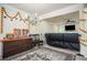 Spacious living room with elegant chandelier, opening into a cozy Gathering room with a fireplace and TV at 856 Donington Cir, Lawrenceville, GA 30045