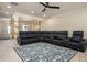Spacious living room featuring a plush, oversized sectional sofa and decorative area rug at 856 Donington Cir, Lawrenceville, GA 30045