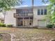 View of the rear exterior of the house, covered patio and backyard at 361 Brackin Trce, Grayson, GA 30017