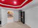 Finished basement room with motorcycle art and shelving at 361 Brackin Trce, Grayson, GA 30017