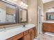 Bright bathroom with double sinks, modern vanity, framed mirrors and ceramic tile flooring at 361 Brackin Trce, Grayson, GA 30017