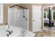Bright bathroom with soaking tub, walk-in shower and doorway to the main bedroom at 361 Brackin Trce, Grayson, GA 30017