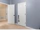 Bedroom featuring freshly painted blue-gray walls and new white doors at 361 Brackin Trce, Grayson, GA 30017