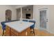 View of kitchen island with seating and access to the outdoor area at 361 Brackin Trce, Grayson, GA 30017