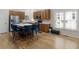 Eat-in kitchen featuring hardwood floors, stainless steel appliances, and a center island with seating at 361 Brackin Trce, Grayson, GA 30017