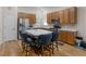 Well-lit kitchen with stainless steel appliances, ample counter space, and a center island with seating at 361 Brackin Trce, Grayson, GA 30017