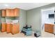 Cozy kitchenette with wooden cabinets, a microwave, and an adjacent bathroom at 361 Brackin Trce, Grayson, GA 30017