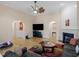 Large living room featuring a fireplace, hardwood floors, arched doorways, and comfortable sofas at 361 Brackin Trce, Grayson, GA 30017