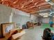 Unfinished basement with concrete walls, wooden beams, and exposed insulation at 361 Brackin Trce, Grayson, GA 30017