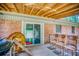 Cozy back porch with wooden chairs, a grill, and sliding door to the backyard at 428 Cornish Mountain Rd, Oxford, GA 30054