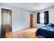 Bedroom features a bed with a blue comforter and wood floor at 428 Cornish Mountain Rd, Oxford, GA 30054