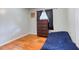 Bedroom with wood floor, window with curtains, and dresser at 428 Cornish Mountain Rd, Oxford, GA 30054