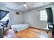 Bedroom with hardwood floors, ample natural light, and a ceiling fan at 428 Cornish Mountain Rd, Oxford, GA 30054