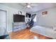 Bedroom featuring hardwood floors, a ceiling fan, and space for a desk at 428 Cornish Mountain Rd, Oxford, GA 30054