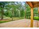 Spacious wooden deck featuring a view of the lush, wooded surroundings at 428 Cornish Mountain Rd, Oxford, GA 30054
