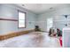 Unfinished garage with a window, a door to the outside, and a brick foundation at 428 Cornish Mountain Rd, Oxford, GA 30054
