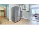 Kitchen area featuring a stainless steel refrigerator and access to other rooms at 428 Cornish Mountain Rd, Oxford, GA 30054