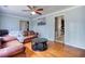 Bright living room with hardwood floors, neutral paint, and a view into the kitchen at 428 Cornish Mountain Rd, Oxford, GA 30054