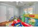 Playroom features wood floors, a ceiling fan, and access to backyard at 428 Cornish Mountain Rd, Oxford, GA 30054