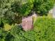 Aerial view showcasing the home's roof and lush, tree-filled surroundings at 115 S Meadowcliff Cir, Carrollton, GA 30116