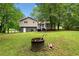Large backyard with mature trees, deck and fire pit area, perfect for outdoor gatherings at 115 S Meadowcliff Cir, Carrollton, GA 30116