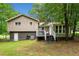 Spacious backyard with a deck and basement entrance, ideal for outdoor activities at 115 S Meadowcliff Cir, Carrollton, GA 30116