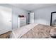 Comfortable bedroom featuring hardwood floors, closet and chest of drawers at 115 S Meadowcliff Cir, Carrollton, GA 30116