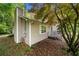 Charming home exterior with a cozy side porch and well-maintained landscaping at 115 S Meadowcliff Cir, Carrollton, GA 30116