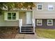 Inviting front entrance with a small porch and white railing at 115 S Meadowcliff Cir, Carrollton, GA 30116