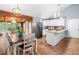 Modern kitchen with white cabinets, stainless steel appliances, and an island at 115 S Meadowcliff Cir, Carrollton, GA 30116