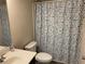 Bathroom featuring a shower with a colorful, patterned curtain and a vanity with sink at 1291 Long Acre Dr, Loganville, GA 30052