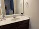 Bathroom vanity featuring solid surface countertop and modern faucet at 1291 Long Acre Dr, Loganville, GA 30052