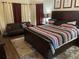 Bedroom with a king bed, gray sofa, and stylish decor accents at 1291 Long Acre Dr, Loganville, GA 30052