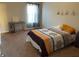 Carpeted bedroom with a bed and window at 1291 Long Acre Dr, Loganville, GA 30052