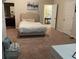 Spacious bedroom featuring neutral walls, plush carpeting and an inviting bed at 1291 Long Acre Dr, Loganville, GA 30052