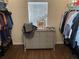Spacious walk-in closet featuring dresser, window and ample hanging storage at 1291 Long Acre Dr, Loganville, GA 30052