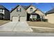 Charming two-story home featuring a two-car garage and well-manicured lawn at 1291 Long Acre Dr, Loganville, GA 30052