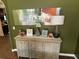 Hallway console table with decorative lamps, flowers, and an abstract art piece add charm to the space at 1291 Long Acre Dr, Loganville, GA 30052