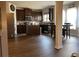 Open floor plan showcasing the kitchen with stainless steel appliances and eat in table at 1291 Long Acre Dr, Loganville, GA 30052