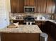 Well-equipped kitchen with stainless steel appliances, granite countertops, and ample cabinet space at 1291 Long Acre Dr, Loganville, GA 30052
