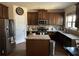 Modern kitchen with stainless steel appliances, granite countertops, and a center island, perfect for cooking and entertaining at 1291 Long Acre Dr, Loganville, GA 30052